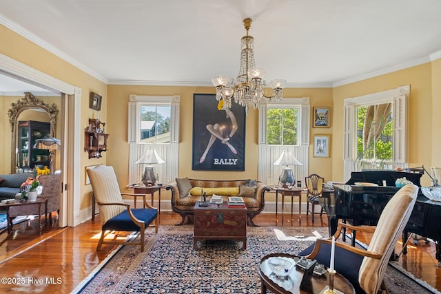 211 S 2nd St, Wilmington, NC 28401 - sitting room with wood finished floors, a chandelier, plenty of natural light, crown molding, and baseboards