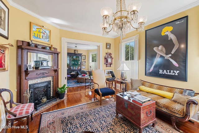 211 S 2nd St, Wilmington, NC 28401 - living area with wood finished floors, crown molding, a fireplace with flush hearth, and a chandelier