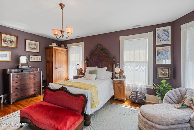 211 S 2nd St, Wilmington, NC 28401 - bedroom with wood finished floors and a chandelier
