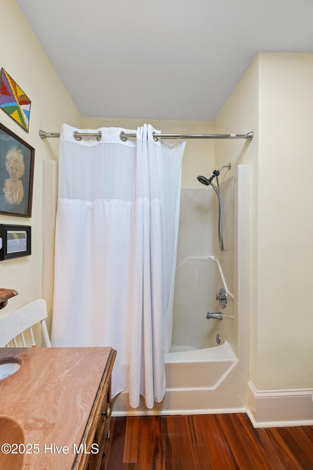 211 S 2nd St, Wilmington, NC 28401 - bathroom featuring wood finished floors, shower / bath combination with curtain, vanity, and baseboards