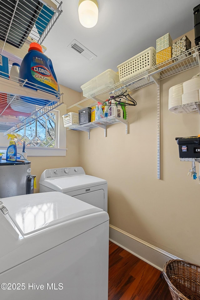 211 S 2nd St, Wilmington, NC 28401 - laundry area with washing machine and dryer, baseboards, and wood finished floors