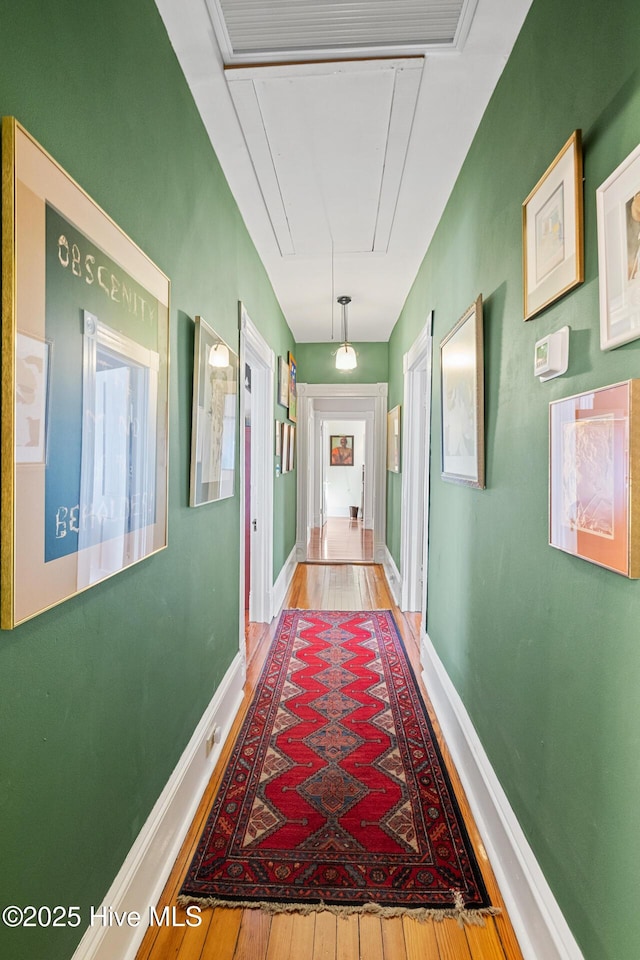 211 S 2nd St, Wilmington, NC 28401 - hall featuring attic access, hardwood / wood-style floors, and baseboards