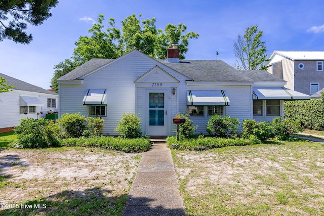 2109 Arendell St, Morehead City, NC 28557 - bungalow-style home featuring a chimney and a shingled roof