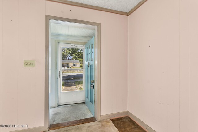 2109 Arendell St, Morehead City, NC 28557 - doorway to outside with carpet, crown molding, and baseboards