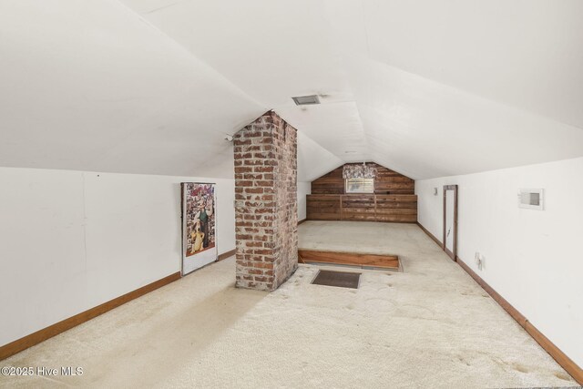 2109 Arendell St, Morehead City, NC 28557 - bonus room with carpet, vaulted ceiling, and baseboards