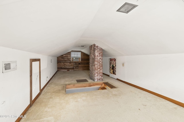 2109 Arendell St, Morehead City, NC 28557 - additional living space featuring baseboards, vaulted ceiling, carpet flooring, wooden walls, and cooling unit