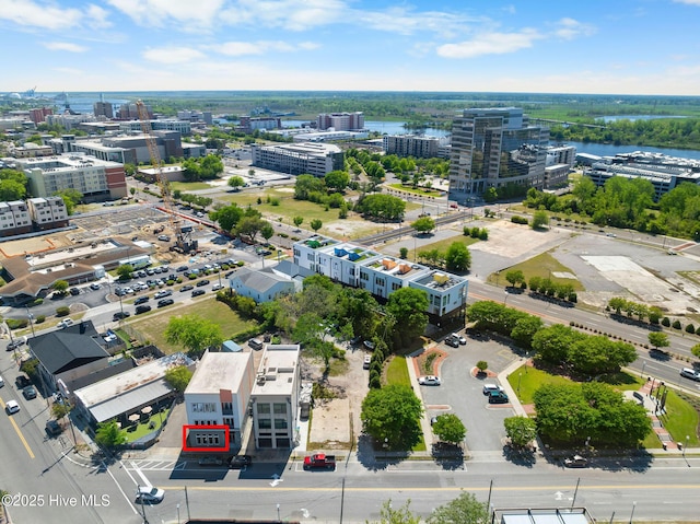 aerial view featuring a view of city and a water view