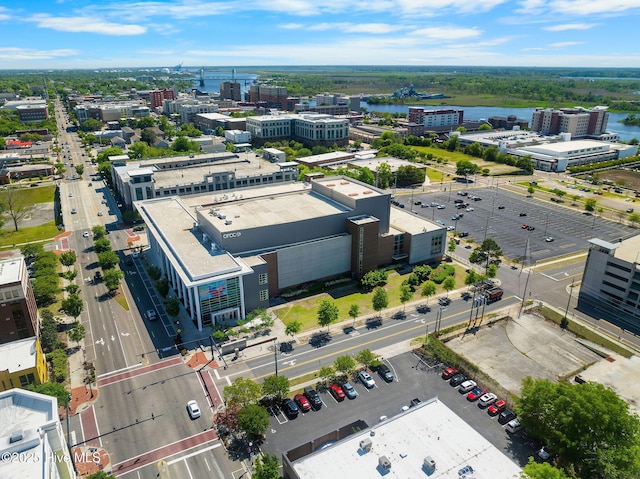 birds eye view of property with a city view and a water view