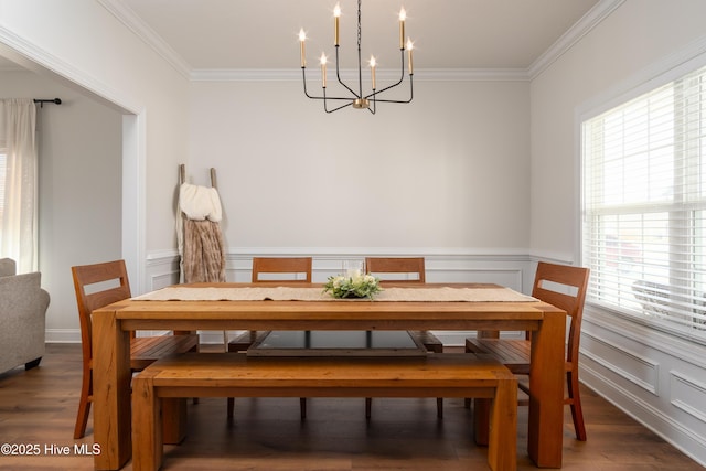 dining room featuring ornamental molding, a chandelier, and a healthy amount of sunlight