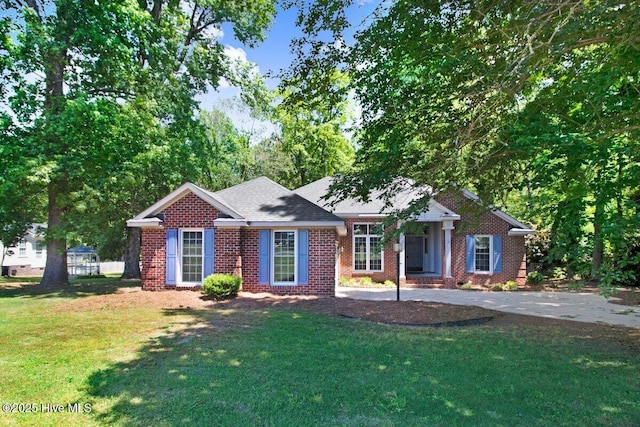 single story home featuring a front lawn and brick siding