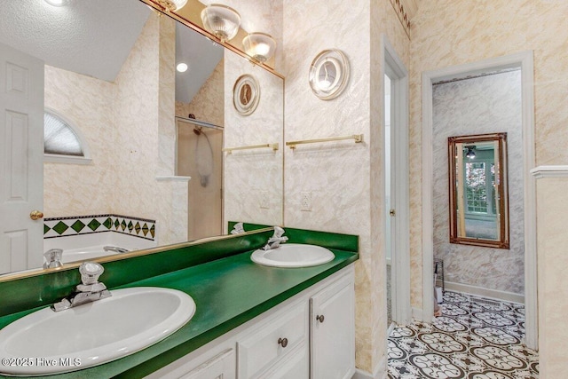 full bathroom featuring a garden tub, double vanity, baseboards, and tile patterned floors