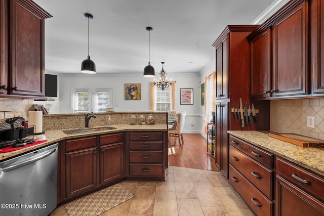 kitchen featuring ornamental molding, a peninsula, dishwasher, a sink, and hanging light fixtures