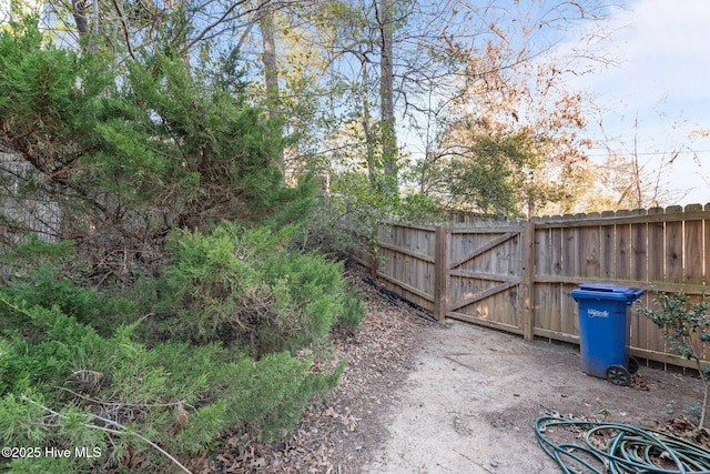 view of gate featuring fence