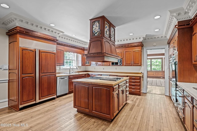 130 Harbour Dr, Hubert, NC 28539 - kitchen with crown molding, stainless steel appliances, light wood finished floors, a kitchen island, and plenty of natural light
