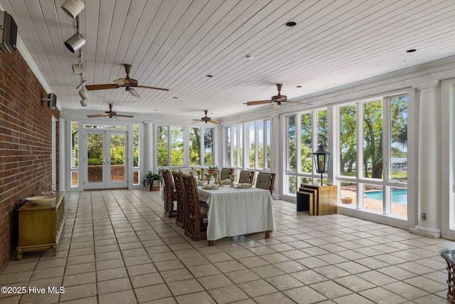 130 Harbour Dr, Hubert, NC 28539 - sunroom with french doors, brick wall, plenty of natural light, tile patterned flooring, and wooden ceiling