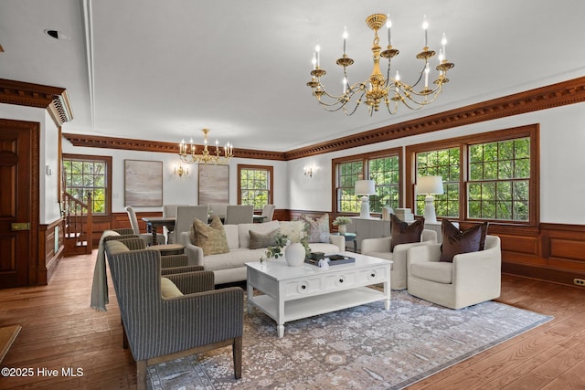 130 Harbour Dr, Hubert, NC 28539 - living area with a chandelier, a wainscoted wall, hardwood / wood-style flooring, healthy amount of natural light, and ornamental molding