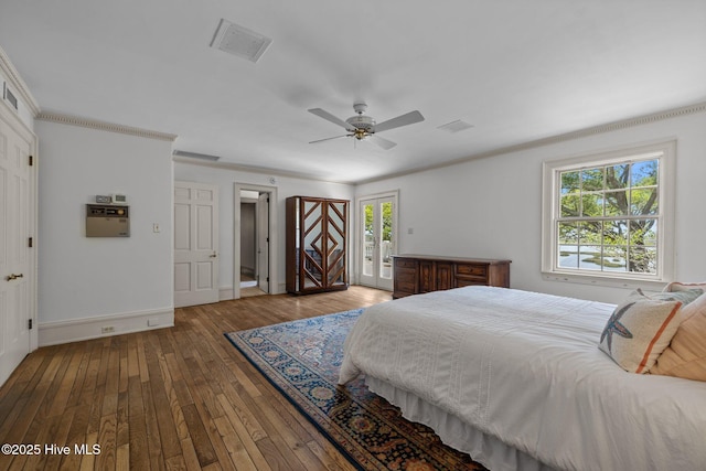 130 Harbour Dr, Hubert, NC 28539 - bedroom featuring access to exterior, hardwood / wood-style flooring, multiple windows, baseboards, and ornamental molding