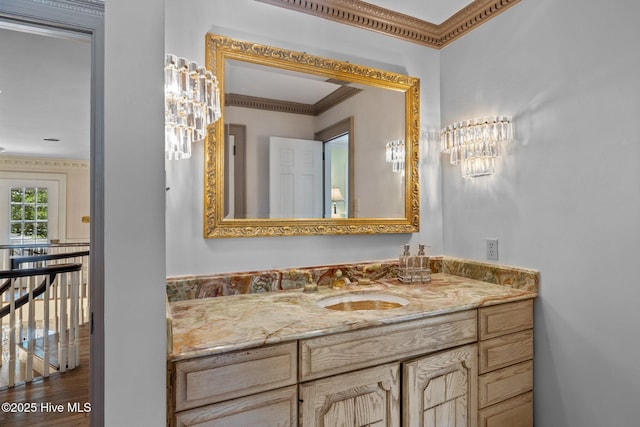 130 Harbour Dr, Hubert, NC 28539 - bathroom with ornamental molding, vanity, a chandelier, and wood finished floors