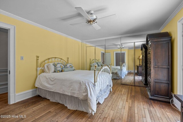 130 Harbour Dr, Hubert, NC 28539 - bedroom featuring hardwood / wood-style flooring, ornamental molding, baseboards, and a ceiling fan