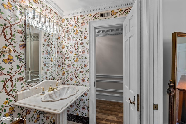 130 Harbour Dr, Hubert, NC 28539 - bathroom featuring wallpapered walls, wood finished floors, and a sink