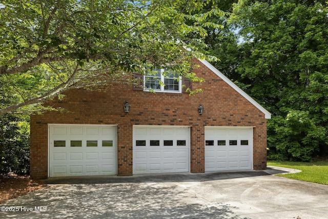 130 Harbour Dr, Hubert, NC 28539 - view of property exterior featuring a garage and brick siding