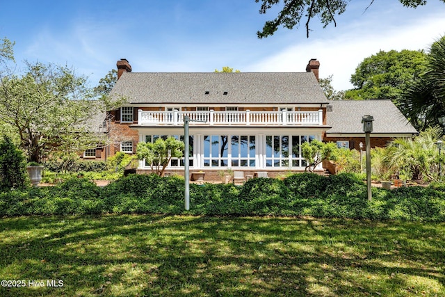130 Harbour Dr, Hubert, NC 28539 - back of house featuring a yard, a balcony, and a chimney