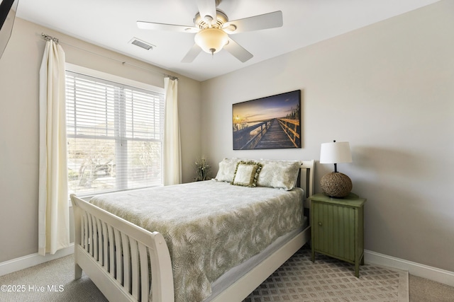 bedroom with ceiling fan, baseboards, carpet floors, and visible vents