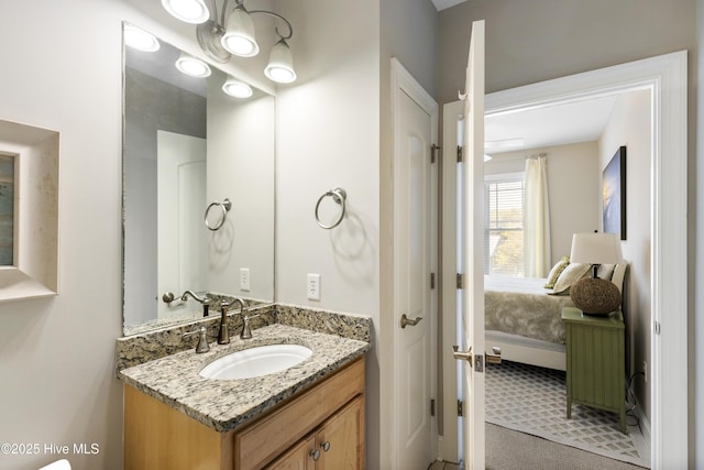 bathroom with vanity and ensuite bathroom