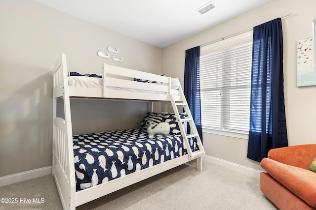 bedroom featuring baseboards, visible vents, and carpet floors
