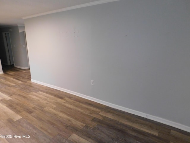 17261 Harvell Ln, Laurinburg, NC 28352 - spare room with ornamental molding, dark wood finished floors, and baseboards