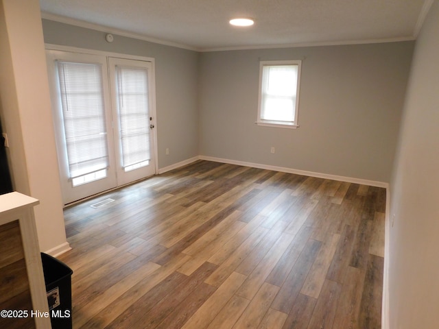 17261 Harvell Ln, Laurinburg, NC 28352 - spare room featuring crown molding, wood finished floors, baseboards, and recessed lighting
