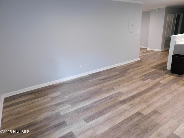 17261 Harvell Ln, Laurinburg, NC 28352 - unfurnished living room with crown molding, wood finished floors, and baseboards