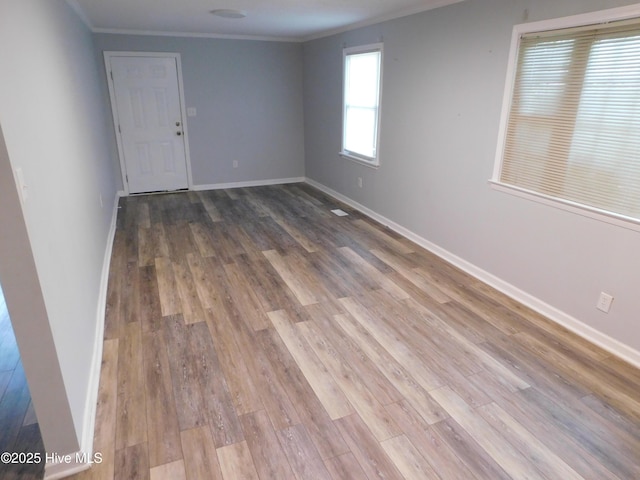 17261 Harvell Ln, Laurinburg, NC 28352 - empty room featuring crown molding, wood finished floors, and baseboards