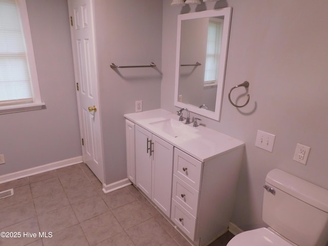 17261 Harvell Ln, Laurinburg, NC 28352 - bathroom featuring toilet, vanity, tile patterned flooring, and baseboards