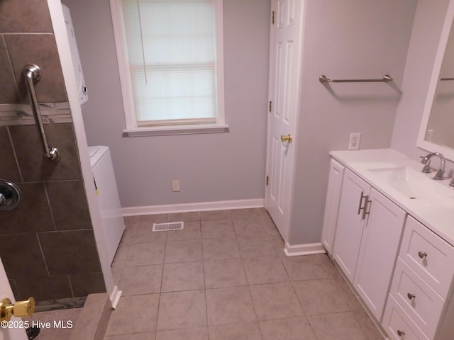 17261 Harvell Ln, Laurinburg, NC 28352 - full bathroom with tile patterned floors, vanity, a tile shower, and baseboards