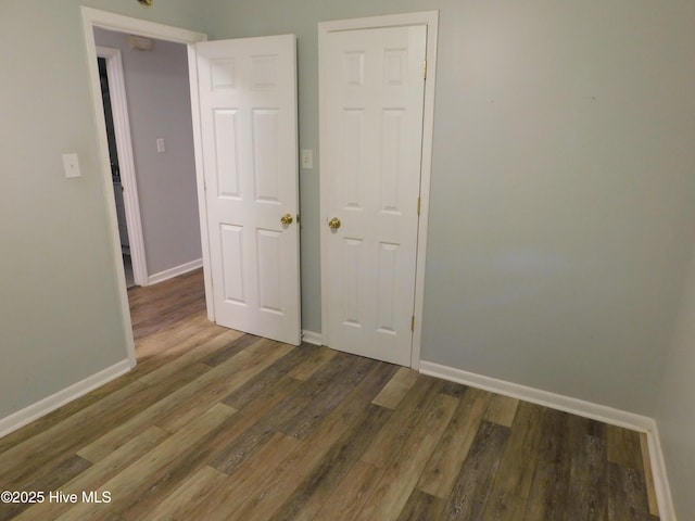 17261 Harvell Ln, Laurinburg, NC 28352 - unfurnished bedroom featuring wood finished floors and baseboards