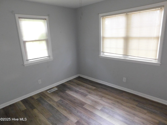 17261 Harvell Ln, Laurinburg, NC 28352 - empty room with dark wood-type flooring and baseboards