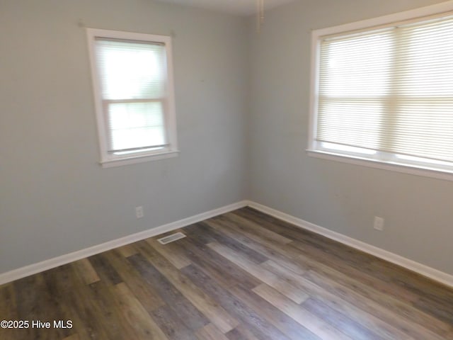 17261 Harvell Ln, Laurinburg, NC 28352 - spare room featuring dark wood finished floors and baseboards