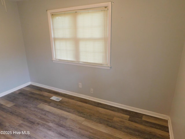 17261 Harvell Ln, Laurinburg, NC 28352 - unfurnished room featuring dark wood finished floors and baseboards