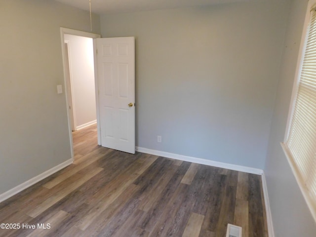 17261 Harvell Ln, Laurinburg, NC 28352 - spare room with baseboards and wood finished floors