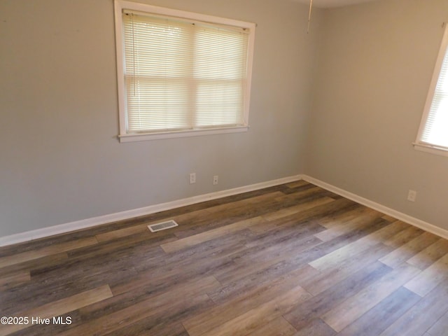 17261 Harvell Ln, Laurinburg, NC 28352 - spare room with dark wood-type flooring and baseboards