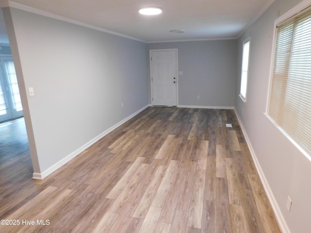 17261 Harvell Ln, Laurinburg, NC 28352 - spare room featuring crown molding, wood finished floors, and baseboards