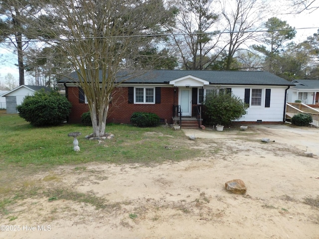 17261 Harvell Ln, Laurinburg, NC 28352 - ranch-style home featuring a front yard and brick siding