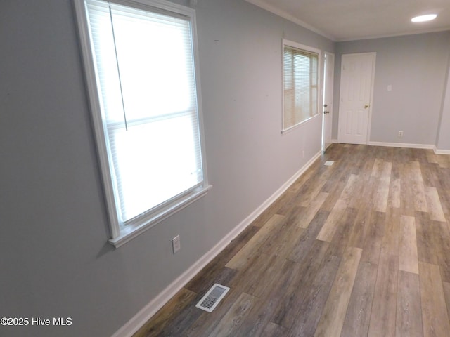 17261 Harvell Ln, Laurinburg, NC 28352 - hallway with wood finished floors, baseboards, and ornamental molding