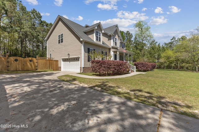 view of side of home featuring a gate, driveway, covered porch, an attached garage, and roof with shingles