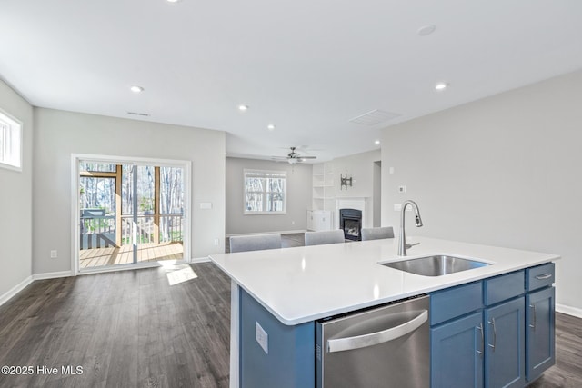 138 Clear Water Rd, Louisburg, NC 27549 - kitchen featuring open floor plan, a sink, blue cabinetry, and stainless steel dishwasher