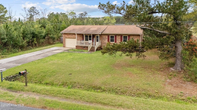 ranch-style house featuring concrete driveway, a front yard, brick siding, a porch, and a garage