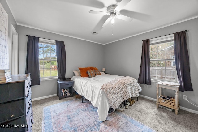 bedroom with carpet flooring, ornamental molding, baseboards, and visible vents