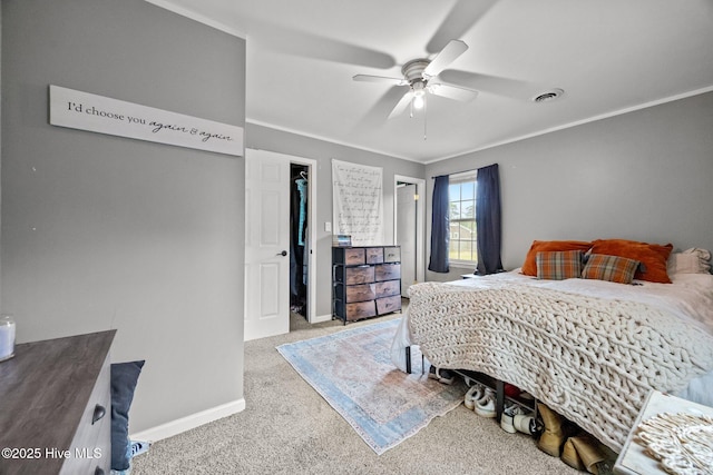 bedroom featuring visible vents, carpet, baseboards, ornamental molding, and ceiling fan