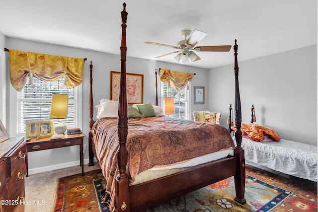 carpeted bedroom with baseboards and a ceiling fan